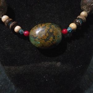 Queen palm seed necklace